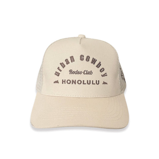 Beige cap with text on a white background