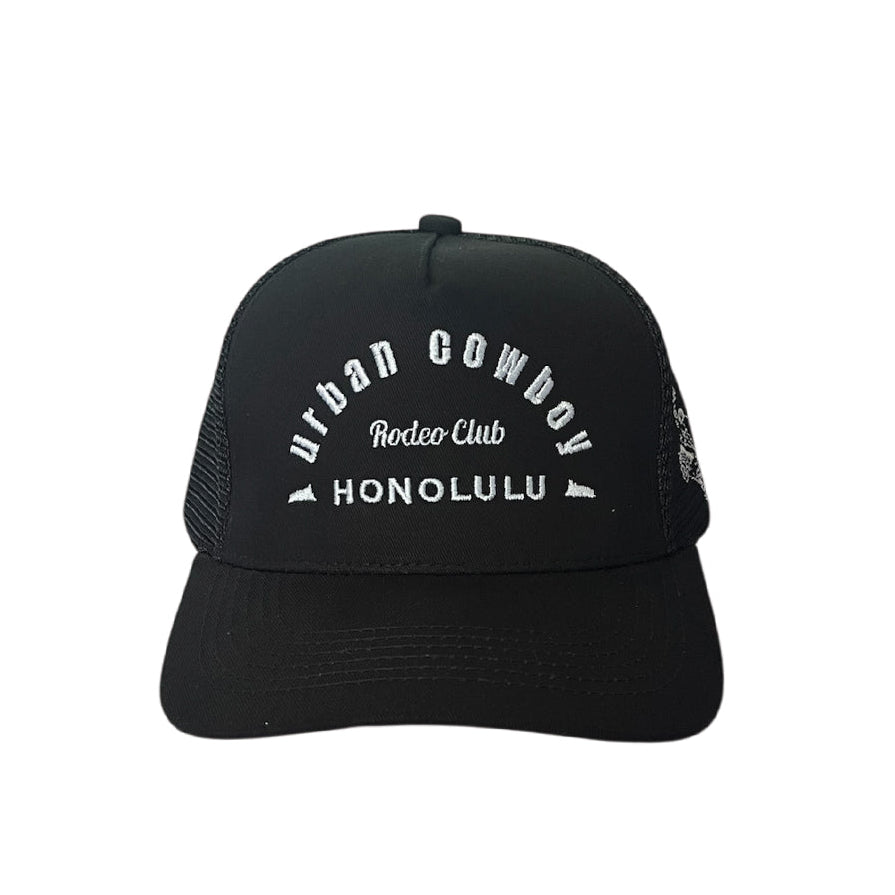 Urban Cowboy Co. black mid-profile snapback hat with white embroidered text and breathable mesh back panel
